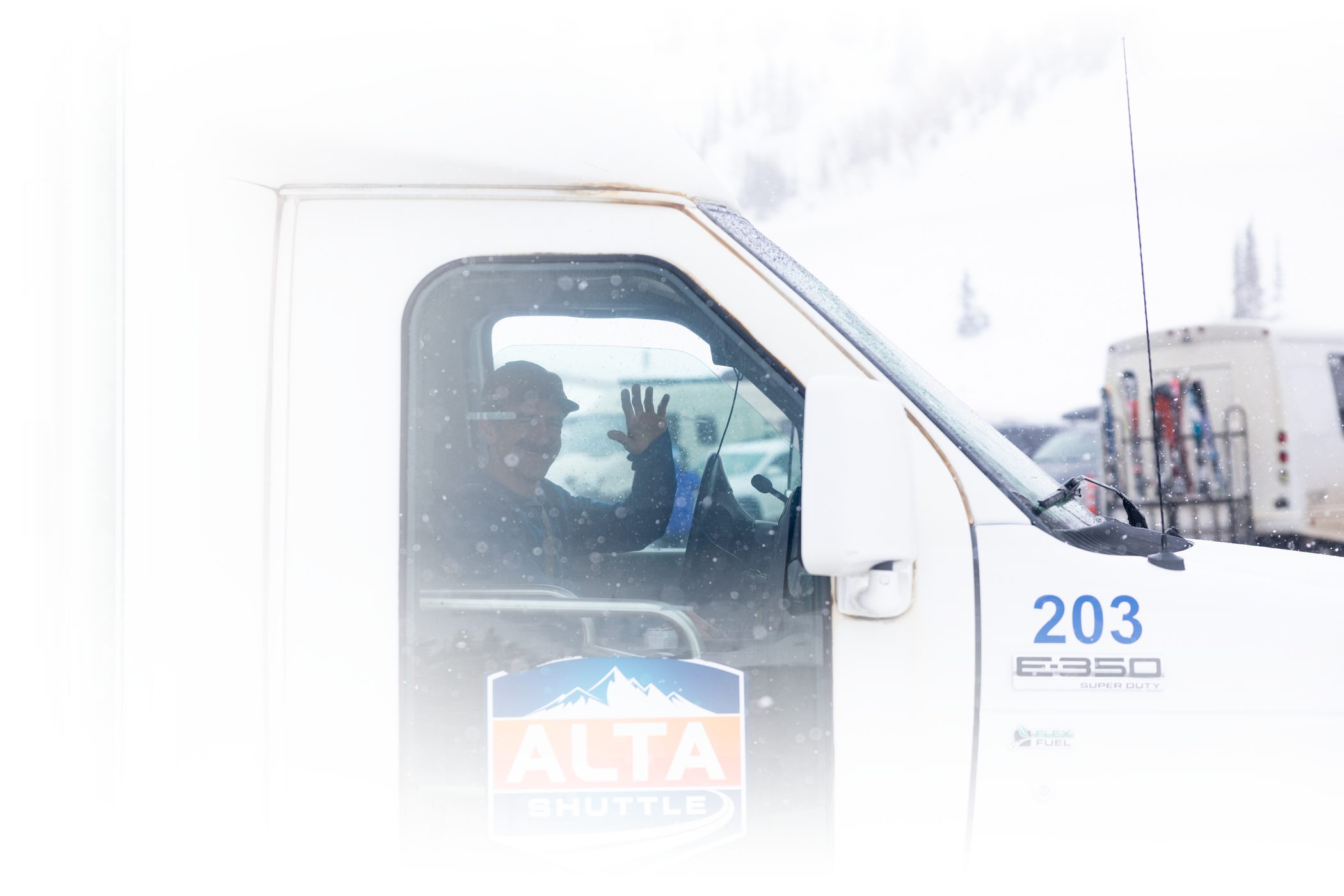 Alta Shuttle driver waving through the winow