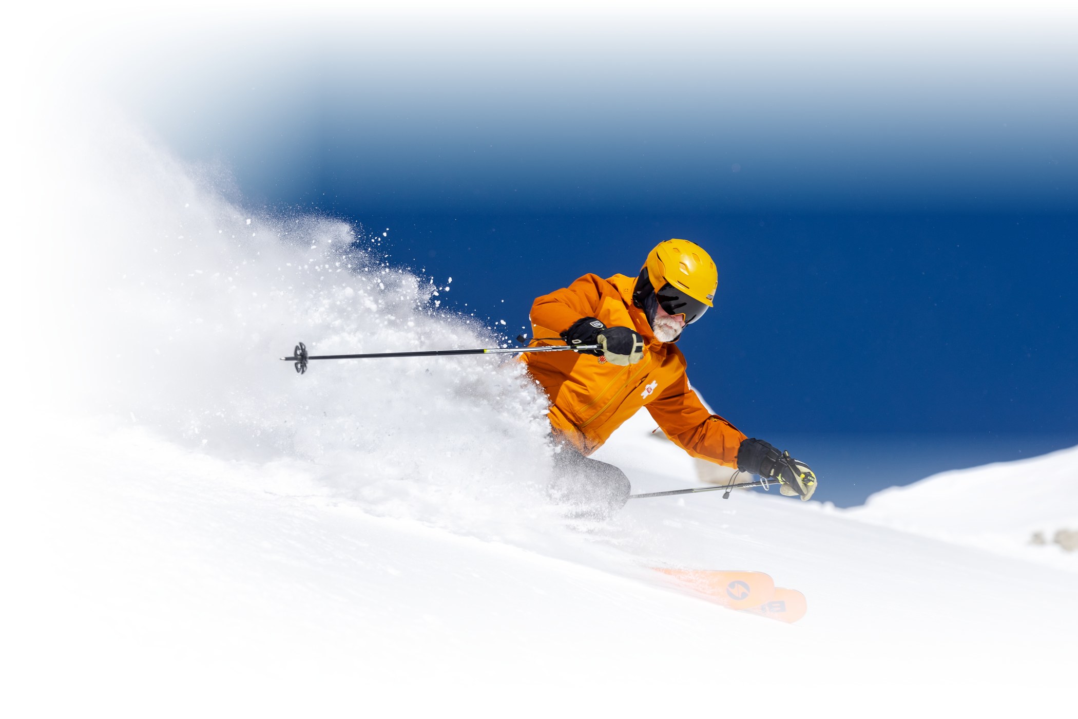 An Alf Engen Ski School instructor guides two skiers around Alta Ski Area on a sunny winter day