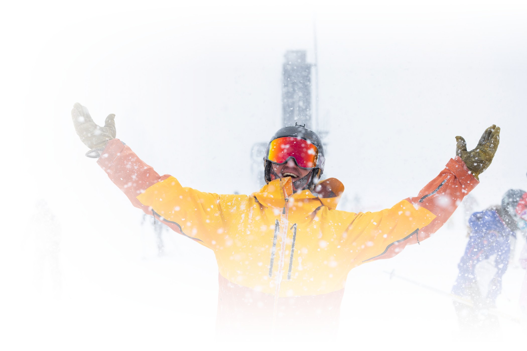 A skier celebrates the new snow on a snowy February day at Alta Ski Area