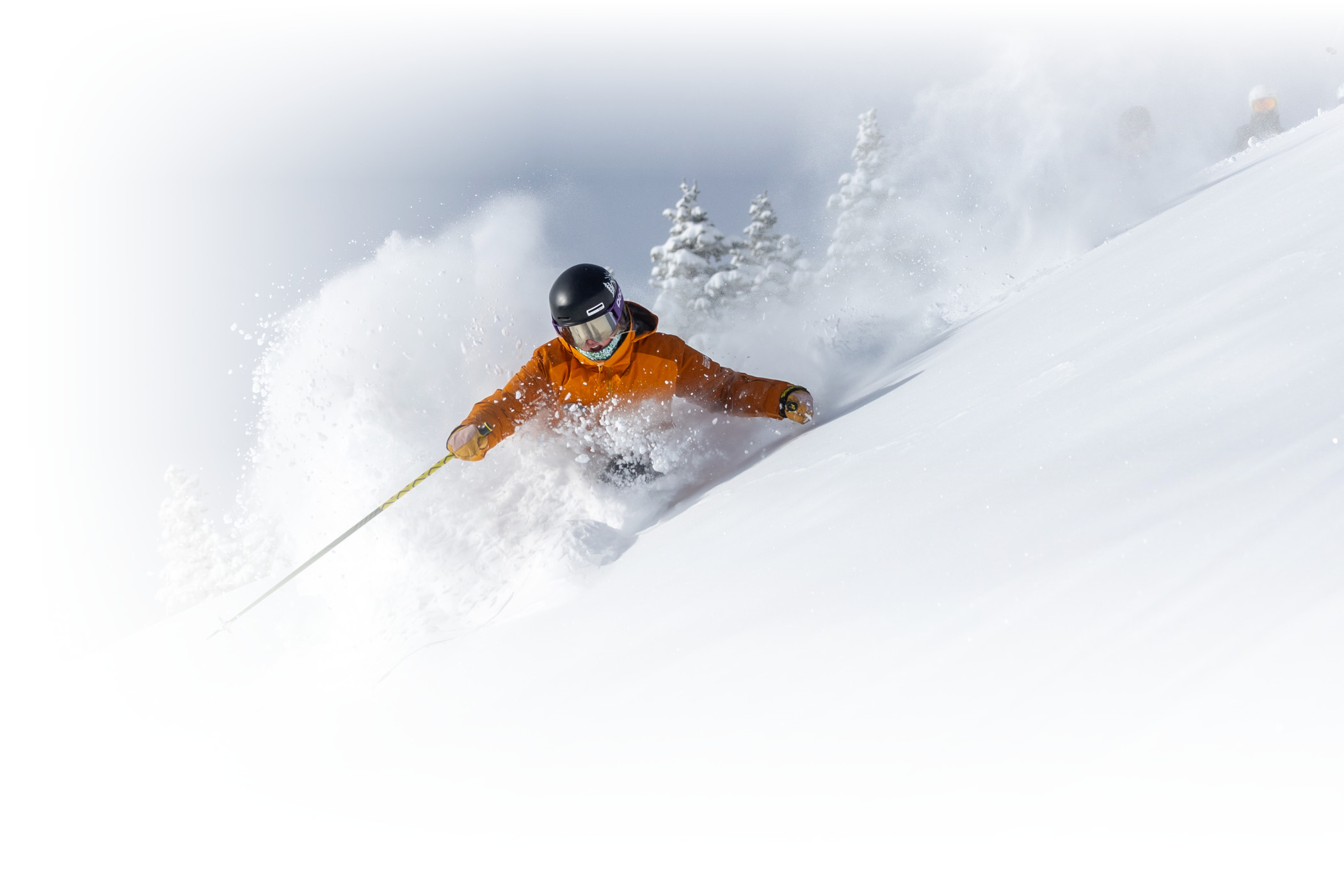 Adult ski school class learning ski skills on expert terrain