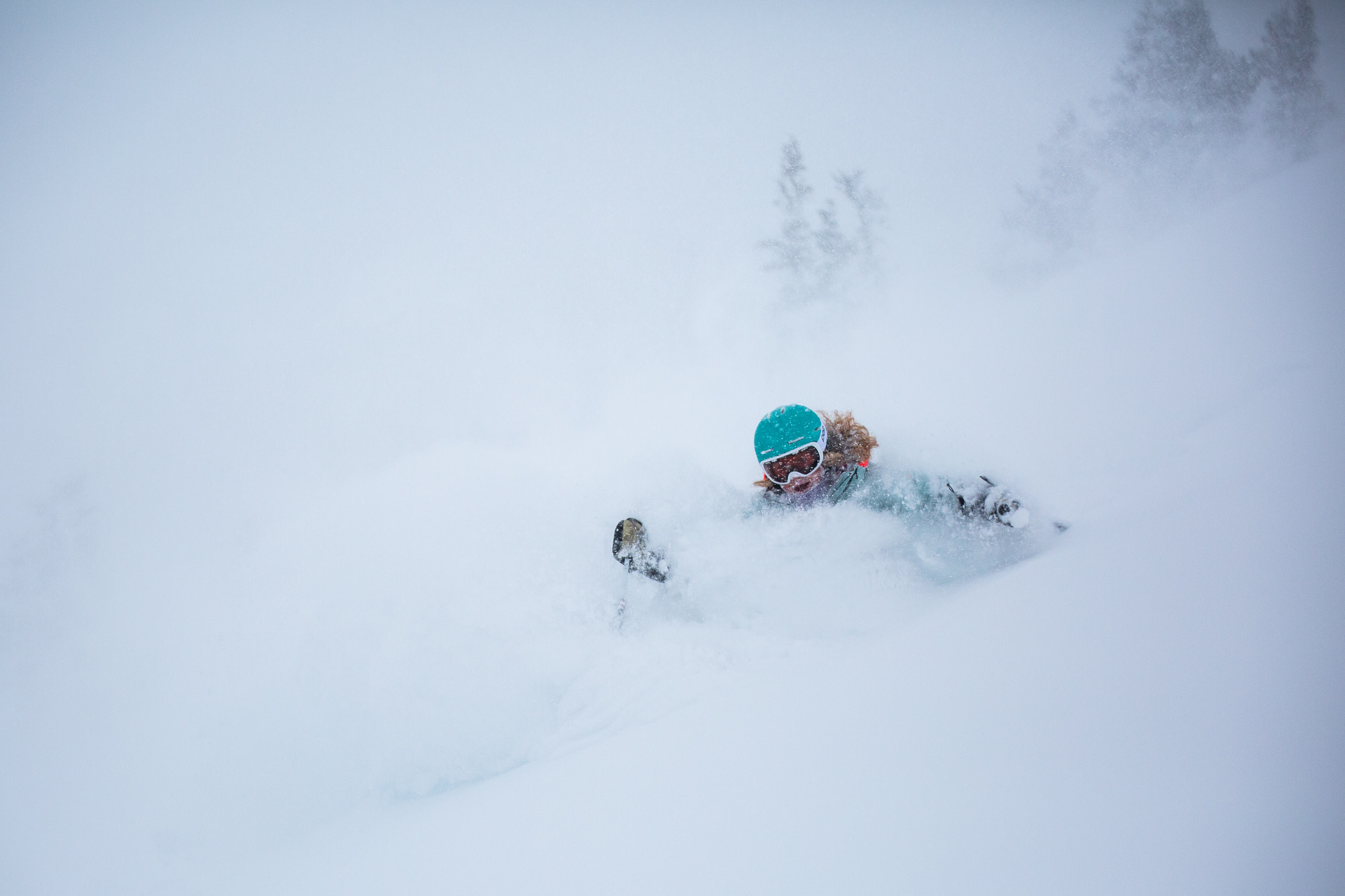 Madison Rose Ostergren emerges from two feet of January powder Photo: Rocko Menzyk