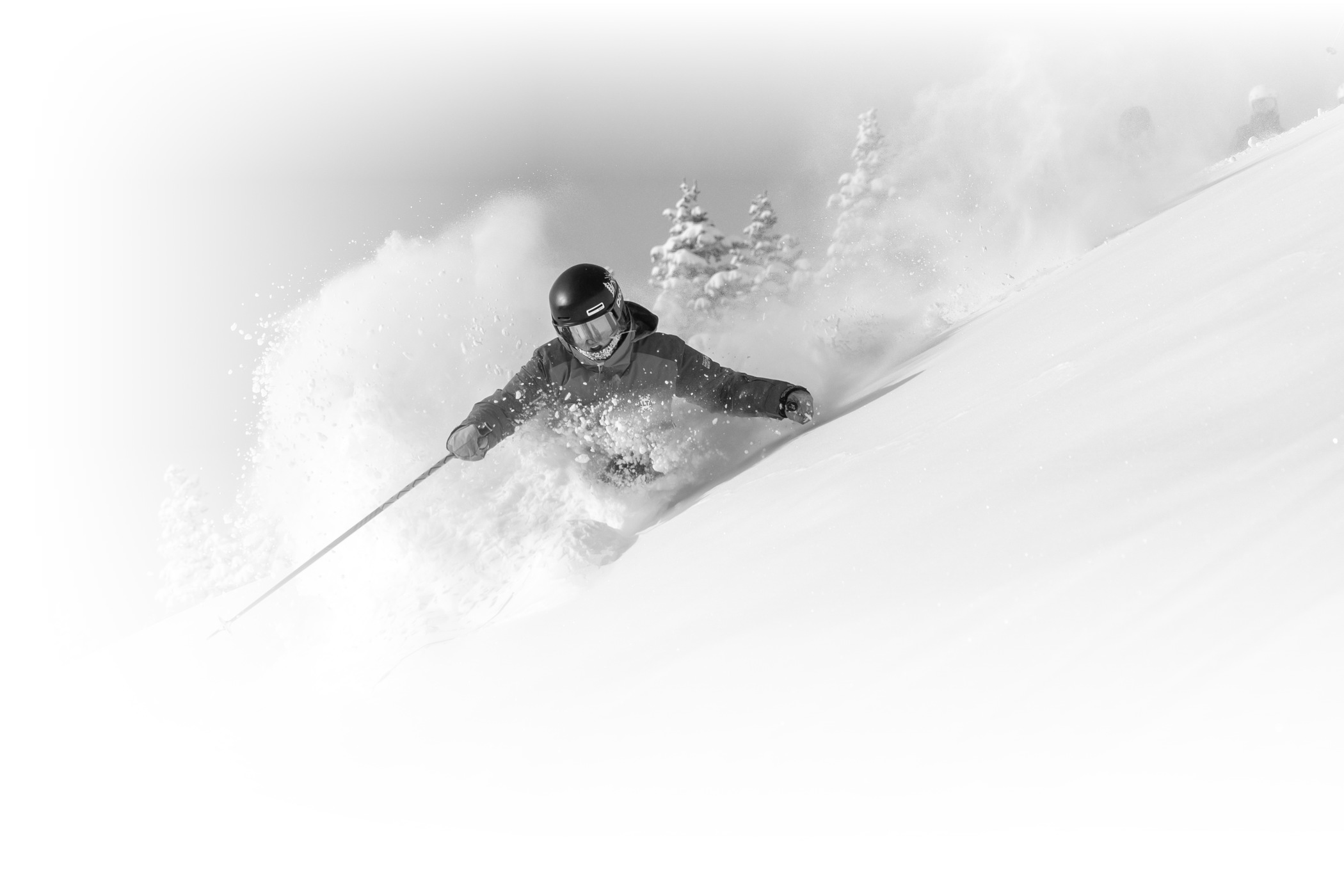 An Alta Ski Area employee smiles while working on a snowy winter day at Alta Ski Area