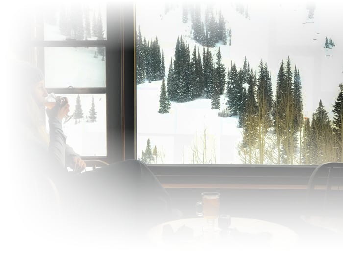 a woman enjoys a cocktail at the sitzmark club at the alta lodge