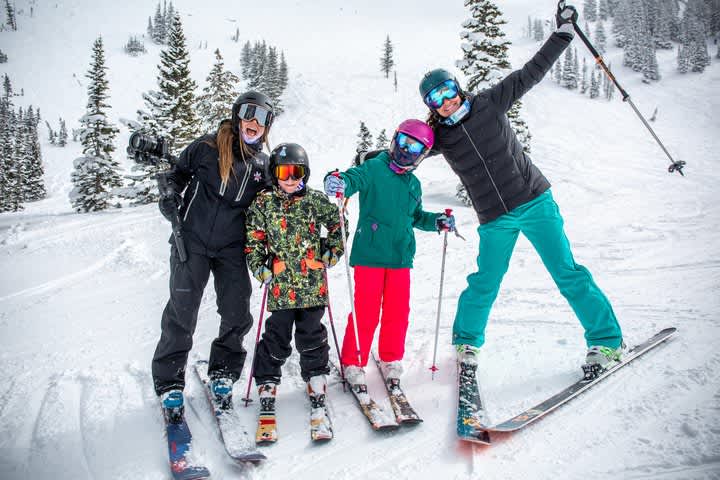 Skiers posing for a goofy photo