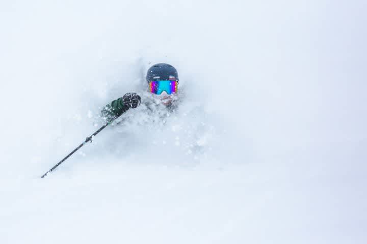 Skier skiing deep fresh snow