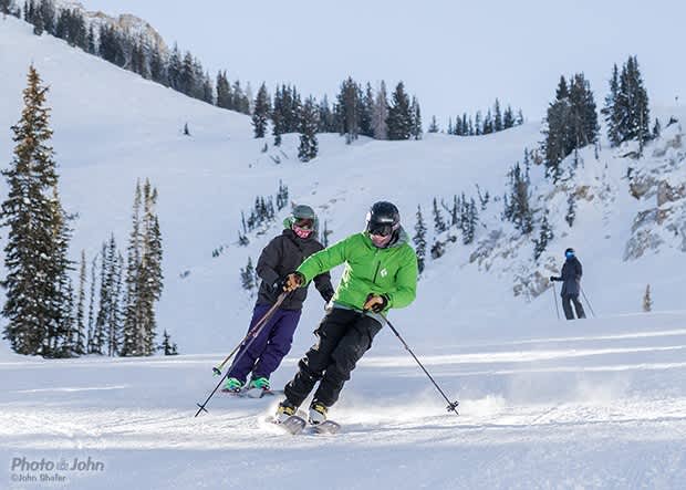 First run of the day – Jim skis a warmup on Aggie’s Alley, followed by his brother Kyle, with his girlfriend JP in the background