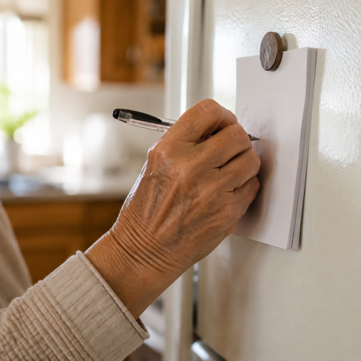 Writing a step count on a fridge notepad