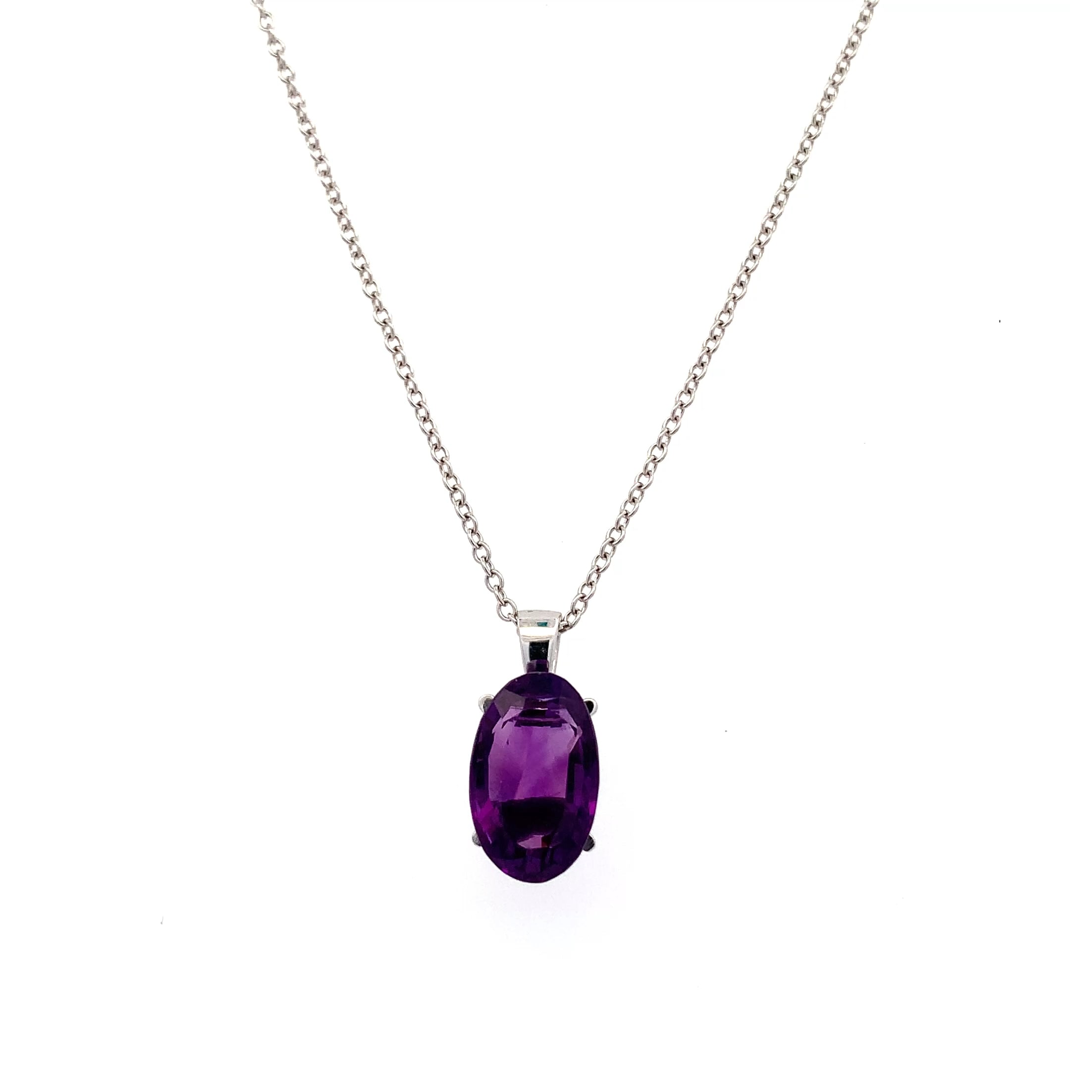 Amethyst purple pendant necklace 18k pendant necklace 18k white gold. This amethyst purple pendant necklace 18k elongated oval cut 3.40ct gemstone pendant is the perfect accessory for any occasion. Crafted with precision, the vibrant hue of the stone measures approximately 13/8mm catches the light beautifully, making it a standout piece. Whether you're dressing up for a night out or adding a touch of elegance to your everyday look, this pendant is sure to impress. Chain 16 inches 18k white gold. Accompanied by valuation This stunning amethyst 3.40ct pendant necklace features a beautifully cut oval shaped gemstone that radiates elegance. The rich purple hue of the amethyst measuring 13/8mm is complemented by a delicate 18k gold chain, making it a perfect accessory for any occasion. Whether you're dressing up for a night out or adding a touch of sophistication to your everyday look, this pendant is sure to turn heads. Accompanied by valuation