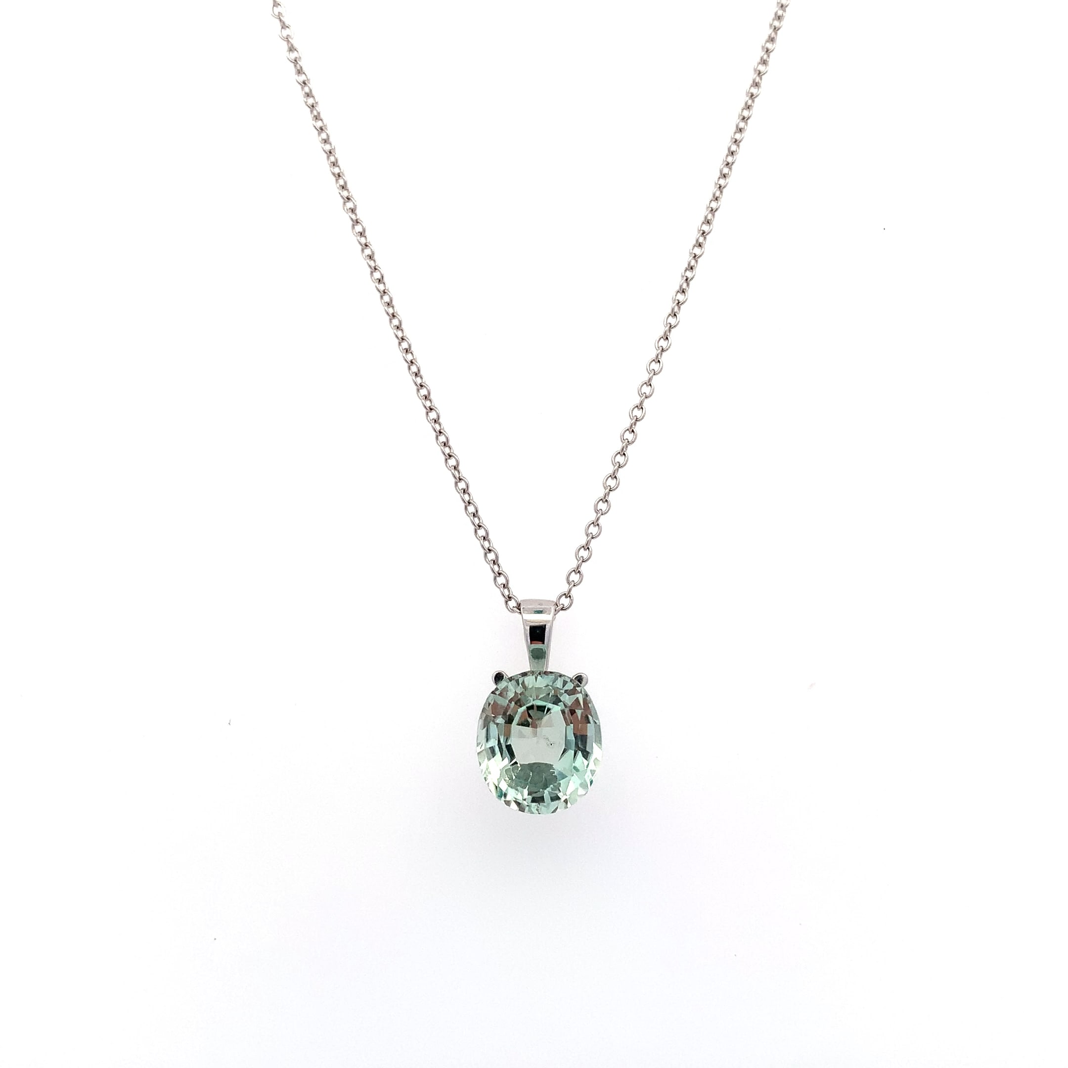 Aquamarine blue sky pendant necklace 18k white gold. This stunning blue aquamarine 3.50ct gemstone pendant is the perfect accessory for any occasion. Crafted with precision, the vibrant hue of the stone measures approximately 10/11mm catches the light beautifully, making it a standout piece. Whether you're dressing up for a night out or adding a touch of elegance to your everyday look, this pendant is sure to impress. Chain 16 inches 18k white gold. Accompanied by valuation