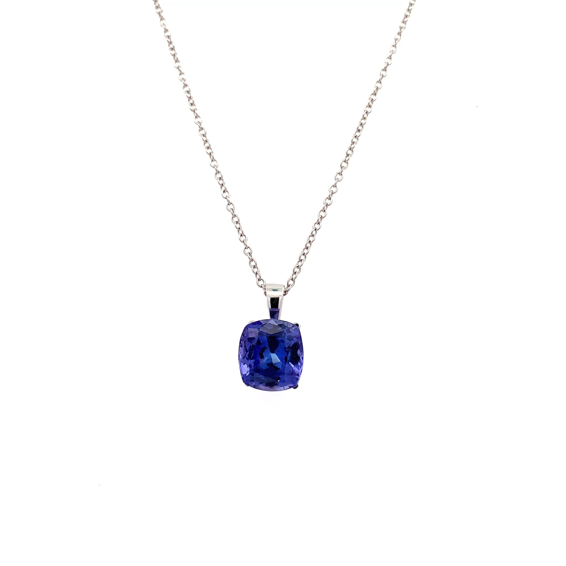This stunning pendant features a captivating blue tanzanite 3.66ct gemstone cushion cut, elegantly suspended from a delicate 18k white gold chain. The rich hue of the tanzanite stone