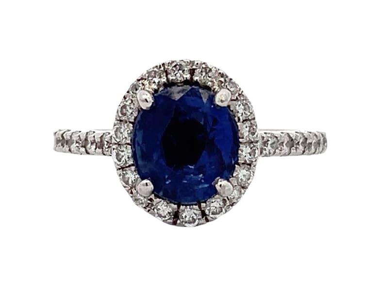 Blue sapphire and diamond halo engagement ring 18k white gold