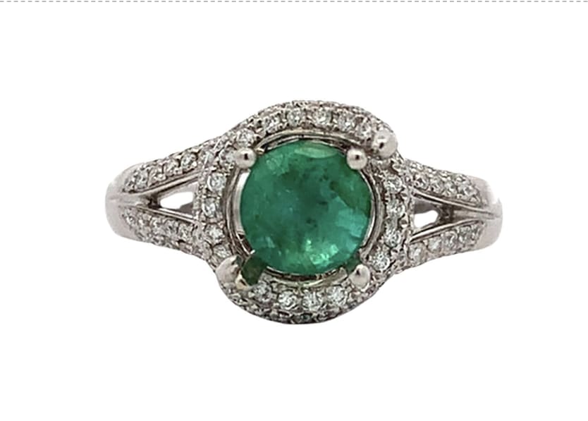 Discover the allure of this stunning green emerald and diamond halo twisted twirl ring, featuring a vibrant vivid green gemstone and diamonds that captures the essence of elegance.