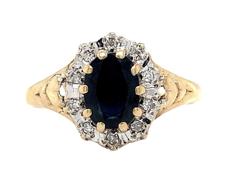 This beautiful engagement ring features a stunning 1.20ct sapphire diamond set in a classic solitaire style. The ring is crafted from 9ct yellow gold and boasts a chunky band width for added durability. The blue-coloured sapphire stone is natural and has excellent cut grade, with a very slightly included (VS1) clarity grade. 1.20ct Sapphire diamond halo antique engagement ring in 9ct yellow gold. Classic blue sapphire oval cut natural untreated total l weight 0.80ct. Diamond halo 0.40ct total weight G colour SI1 clarity in 9ct yellow gold. Blue Ceylon sapphire oval shaped with diamond halo cluster in 9k yellow gold antique style ring. Hallmarked. The ring can be resized Comes with a bag. Valuation included. The ring is perfect for those looking for a timeless and elegant engagement ring. It comes with certification and is part of the Sapphire Engagement Ring collection. The ring is available in size M and is sure to make a statement with its stunning design.