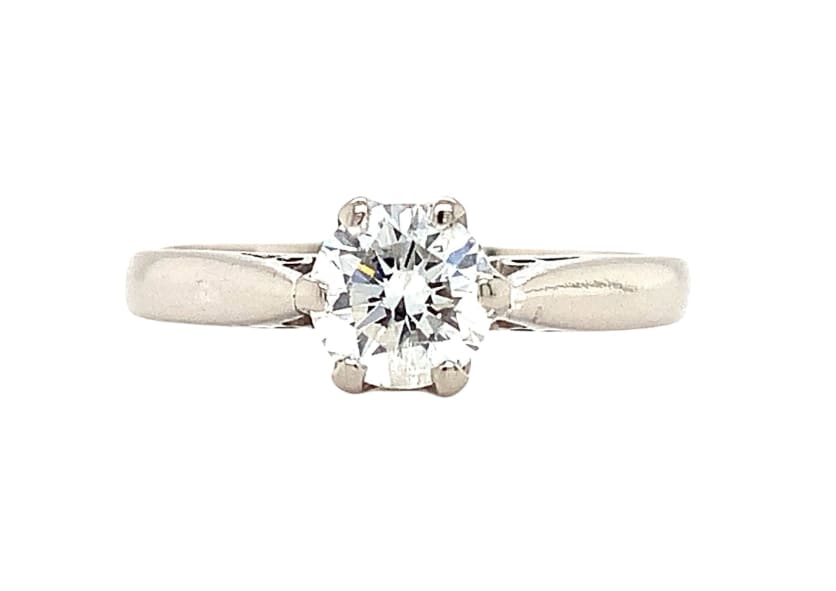 This exquisite 0.63ct diamond engagement ring is set in 18ct white gold, perfect for any special occasion. The round natural diamond boasts an excellent cut grade and a slightly included (SI1) clarity grade, ensuring maximum sparkle and shine.