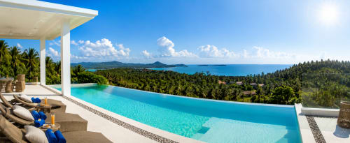 Luxury infinity pool at Indigo Villa Samui overlooking turquoise Koh Samui bay with tropical forest and mountains