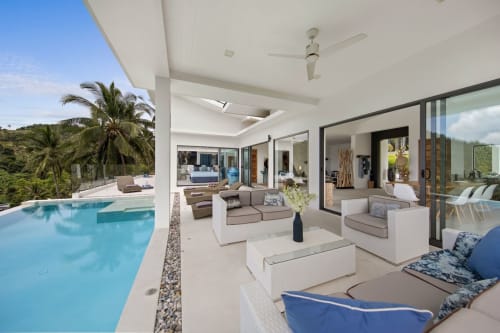 Private swimming pool with comfortable chairs | Experience Breathtaking Sea Views at Villa Indigo