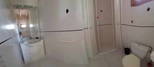 Modern bathroom in Sunflowers and Poppies cottage at Les Gites de Campardon, Monties, with shower, washbasin, and WC