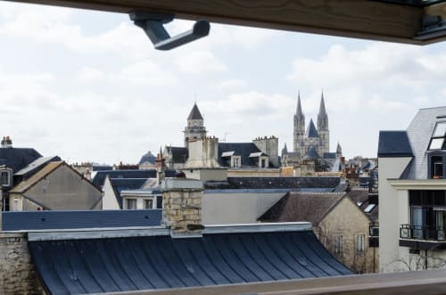 View of Caen Cathedral spires from Villa République Normandie loft balcony, Normandy