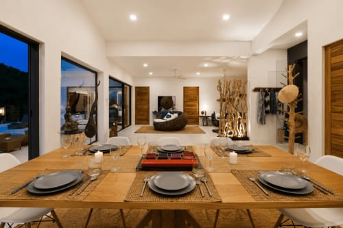 Modern dining room at Indigo Villa Samui with wooden table, sea view, and contemporary décor in Ko Samui