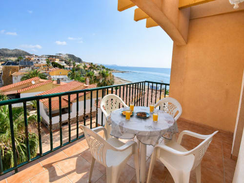 Beachfront terrace with sea view at Apartamentos El Calón Playa, Cuevas del Almanzora, featuring dining table and