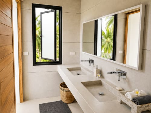 Modern villa bathroom at Indigo Villa Samui with dual sinks, mirrors, tropical views through windows