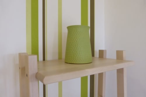 Modern wooden shelf with green striped wallpaper and lime green lamp in Bambou room at Villa Thébaïde B&B, Laudun L'Ardoise