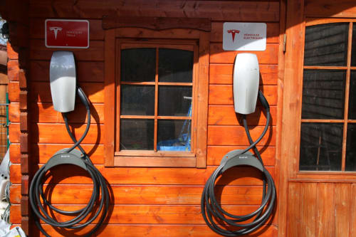 Tesla electric vehicle charging stations at Maison Addama, Neyron, France