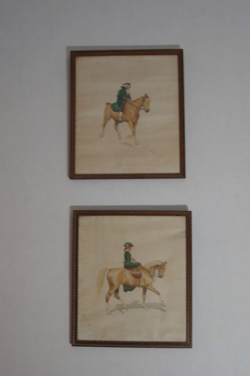 Framed equestrian artwork depicting riders on horseback in Domaine de Lamartine's Grand-mère room