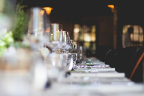 Elegant table setting at Chalet Du Bel Event with wine glasses and place settings for fine dining