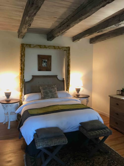 Camomille bedroom at Manoir De Rieuzal with exposed beams, canopy bed, elegant furnishings, and warm lighting