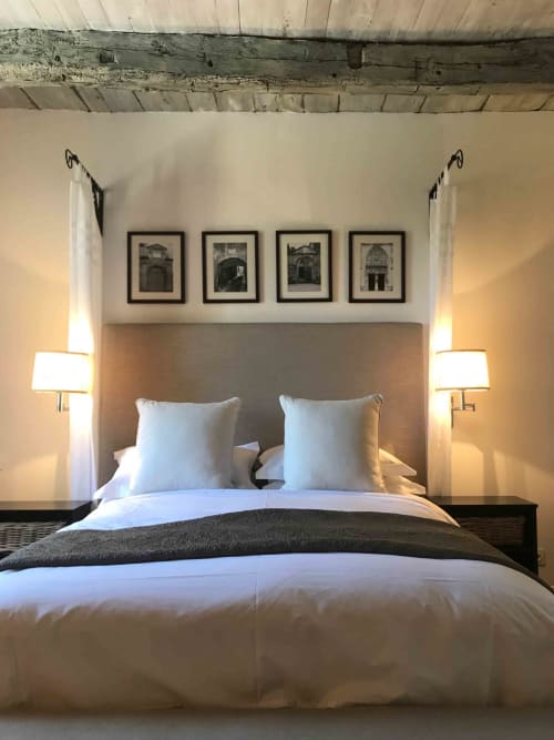 Verveine room at Manoir De Rieuzal: elegant bedroom with beige headboard, white bedding, twin lamps, four framed