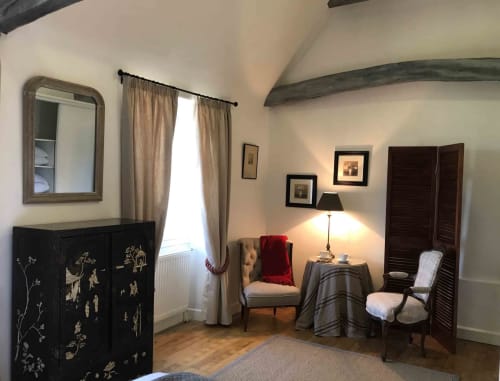 Tilleul room at Manoir De Rieuzal in Loubressac with sitting area, beamed ceiling, period furnishings and mountain views