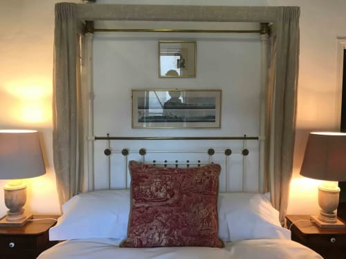 Tilleul room at Manoir De Rieuzal with four-poster bed, mountain views, and bedside lamps in Loubressac, France