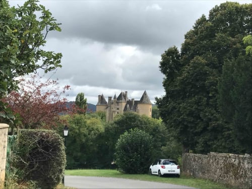 Medieval castle view from Manoir De Rieuzal gardens in Loubressac, France