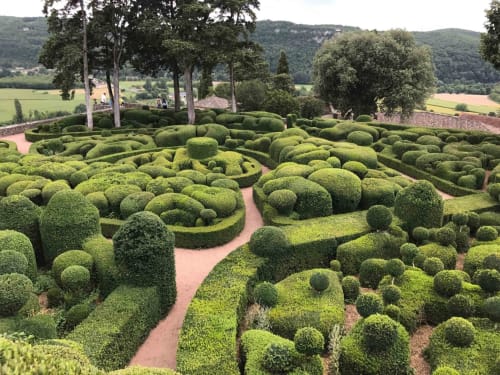 Ornate boxwood hedge maze garden at Manoir De Rieuzal in Loubressac, France
