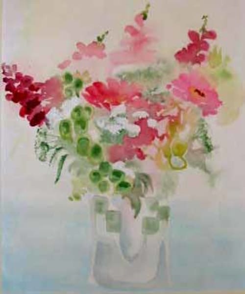 Colorful pink and red flowers in white vase at Manoir De Rieuzal, a charming bed and breakfast in Loubressac, France