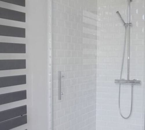 Modern shower enclosure with white subway tiles and chrome rainfall showerhead in Superior Double Room at Le château