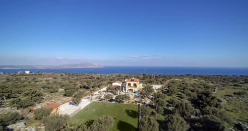 Villa Freedom B&B aerial view with green gardens, pool, and Mediterranean Sea in Kokkino Chorio, Crete