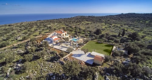 Villa Freedom aerial view in Kokkino Chorio, Crete with terracotta-roofed villa, pool, and sea views