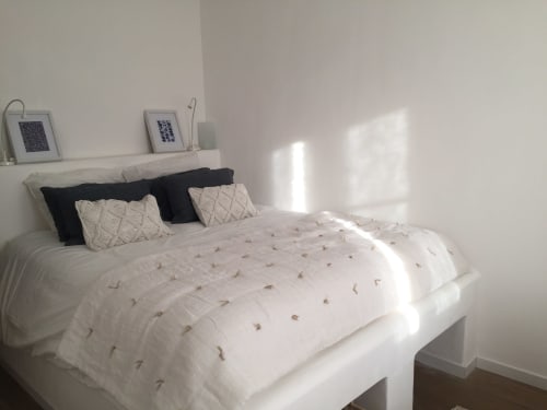Bright bedroom at Saint Martin villa in Ollioules with white bed, patterned pillows, and mountain light
