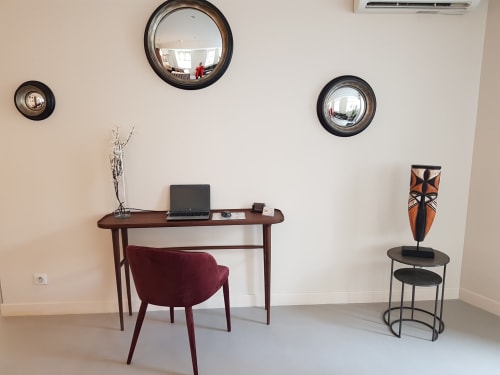 Modern workspace at Hotel Au Bon Coin in Biarritz with desk, burgundy chair, and contemporary mirrors
