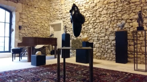 Contemporary art gallery at Mas des Artistes B&B in Mouriès with stone walls and sculptures