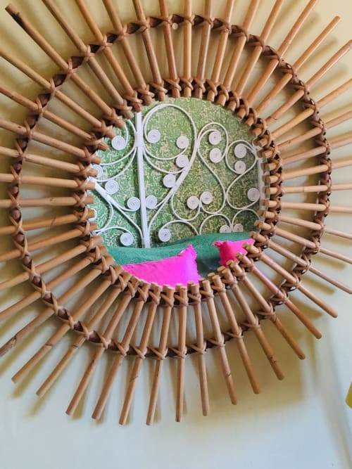 Decorative woven wall art with ornamental metal tree design at Saint Martin B&B in Ollioules, France