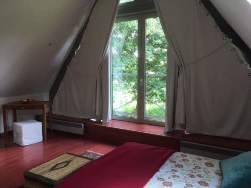 Attic bedroom in Cottage La Bouverie at La Chatellenie B&B, Saint Aubin le Cauf, with river view through large windows and