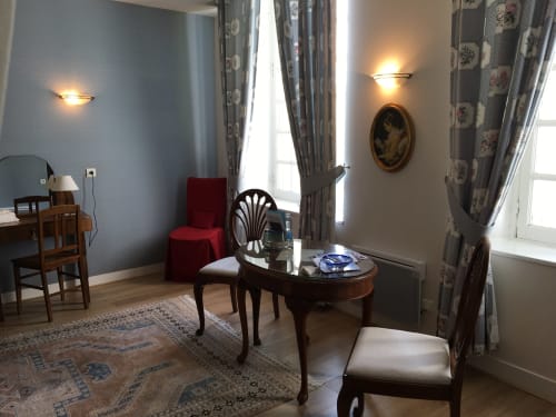 Elegant Superior Room sitting area at La Chatellenie with garden view, period furniture and classical decor