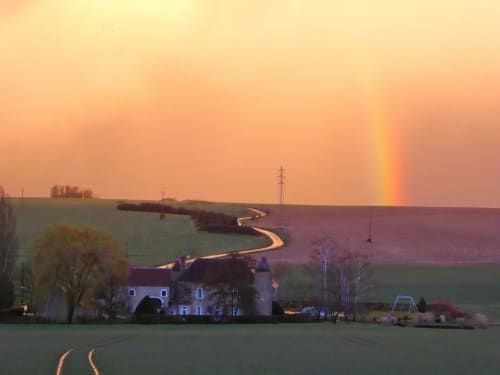 Rainbow over the castle of Ribourdin in Burgundy