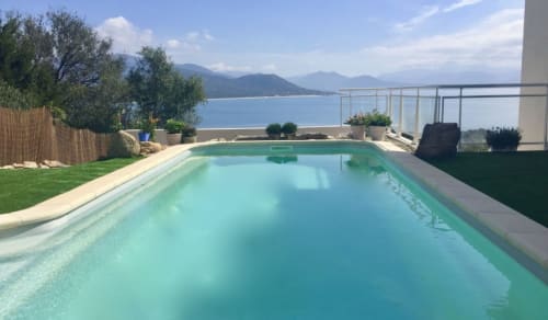 Luxury swimming pool at Villas Marincelu overlooking Porto Pollo beach and Mediterranean mountains, Corsica