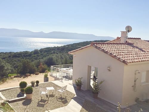 Villas Marincelu terrace with sea view overlooking Porto Pollo, Corsica, with Mediterranean architecture