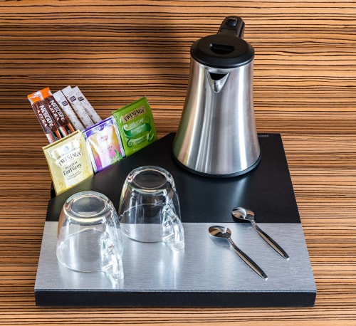 Tea and coffee welcome tray with kettle, glasses, and Twinings tea selection in a Superior Room at Hotel Residence Europe &