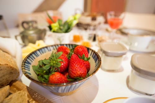 Fresh strawberries in a decorative bowl at Clos Saint Jacques breakfast table in Meursault, France